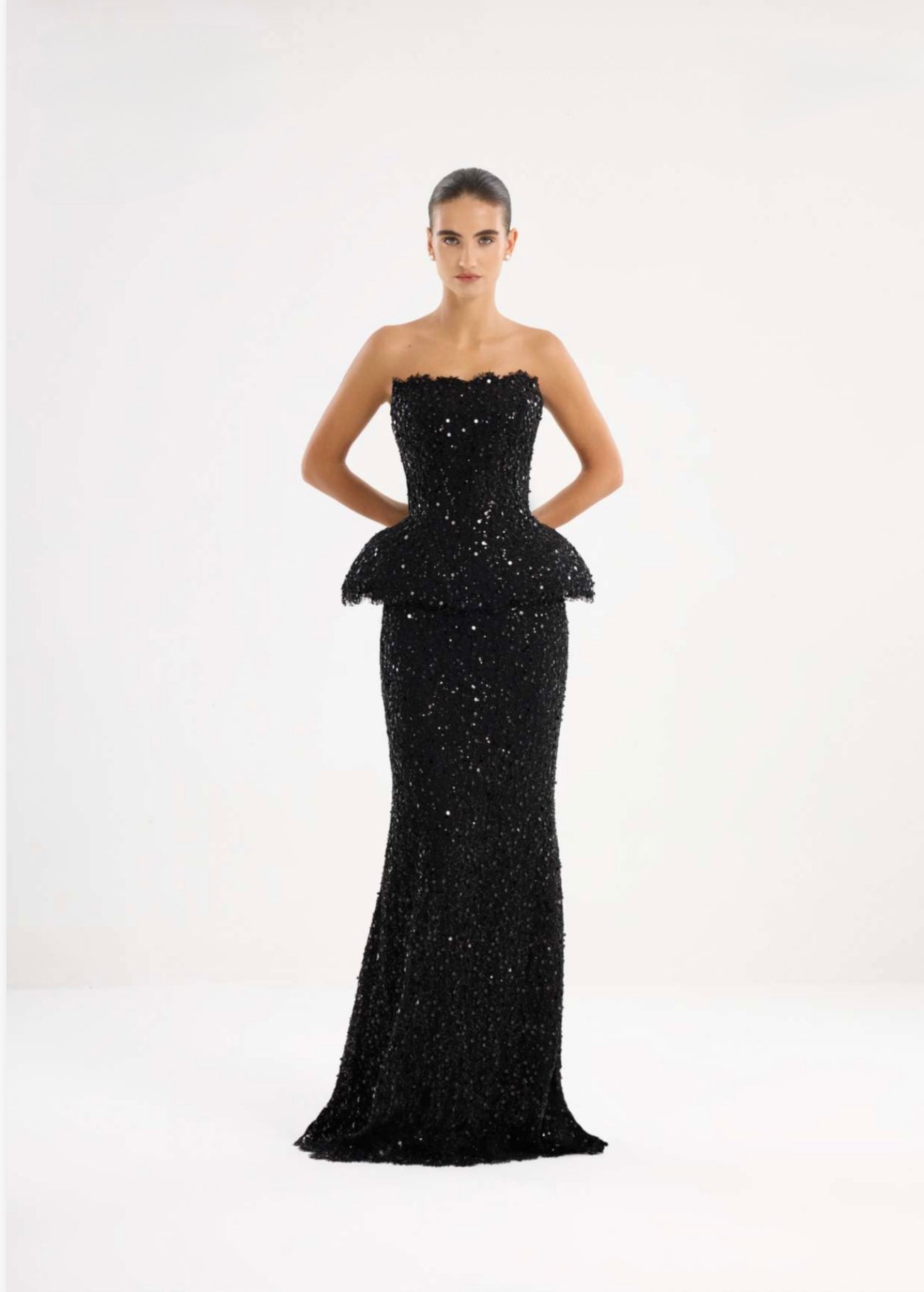 Black strapless embellished peplum gown