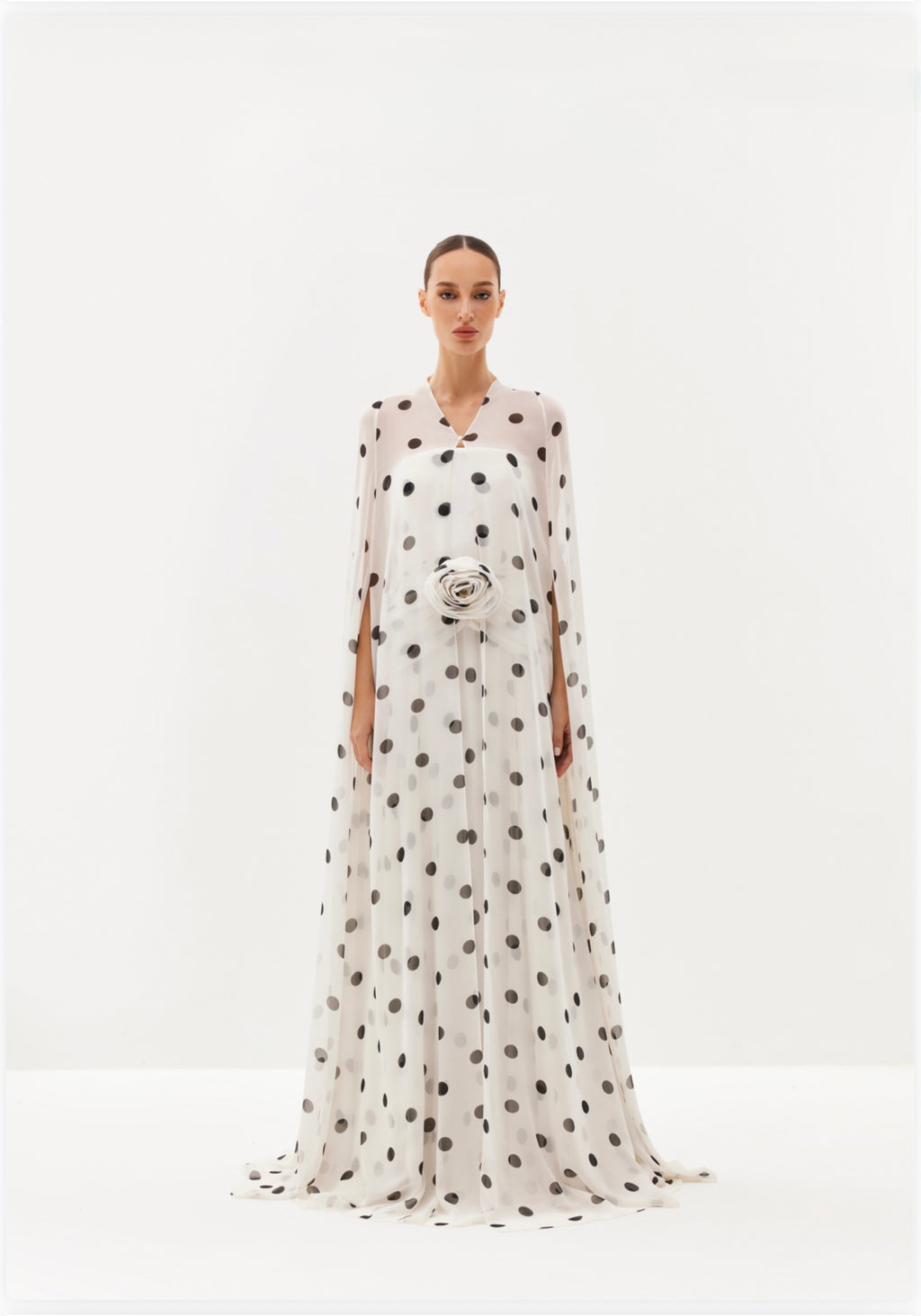 White polka-dot maxi dress with sheer cape