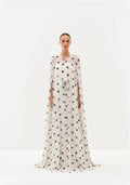 White polka-dot maxi dress with sheer cape