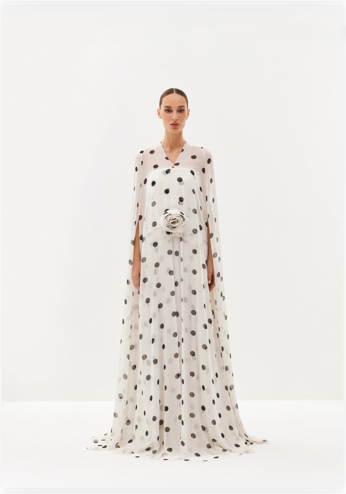 White polka-dot maxi dress with sheer cape