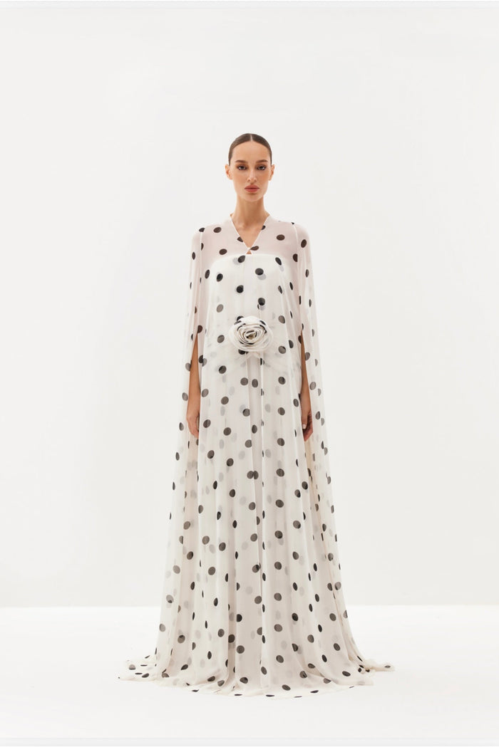 White polka-dot maxi dress with sheer cape