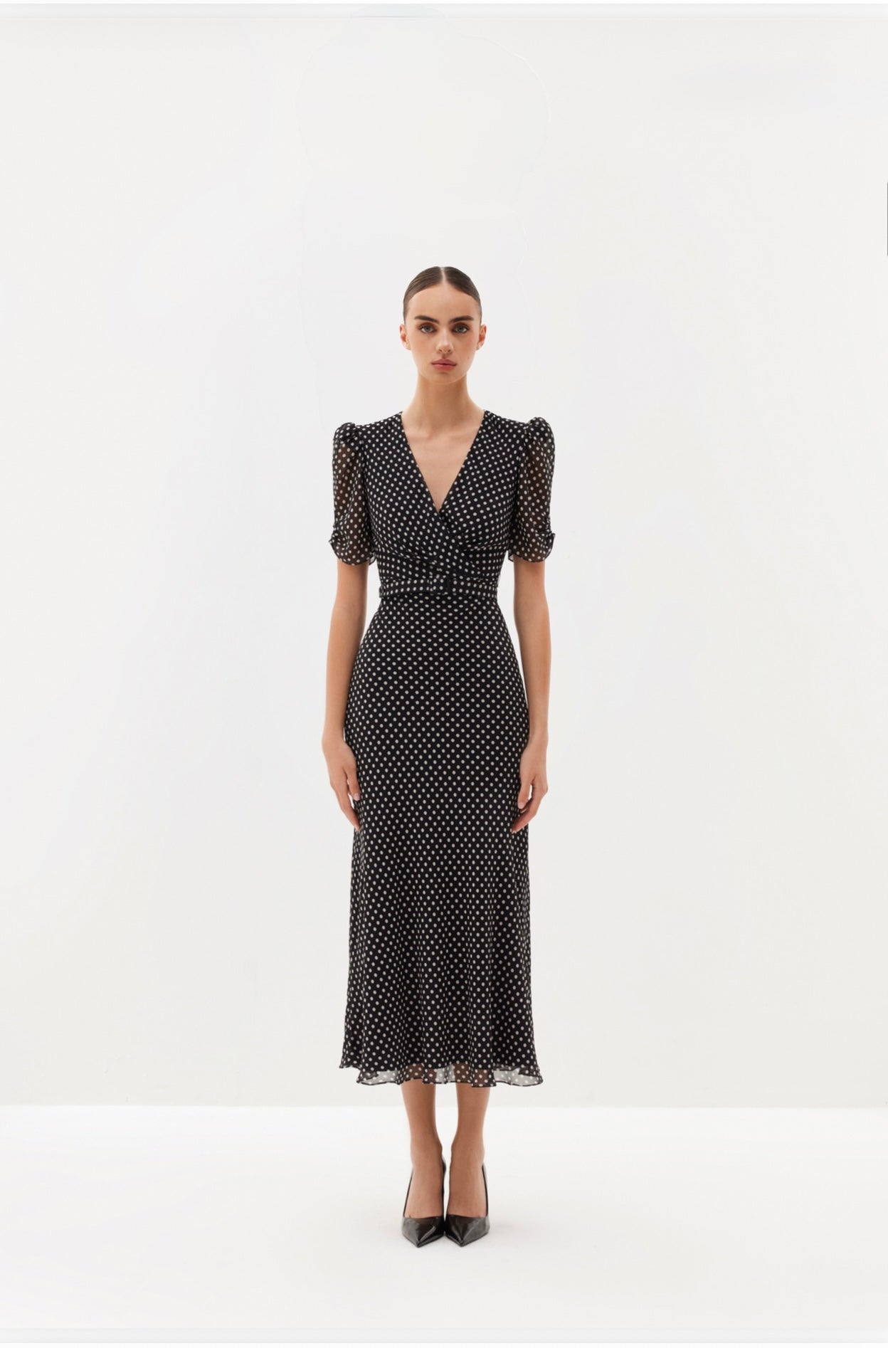 Black polka-dot midi dress with V-neckline