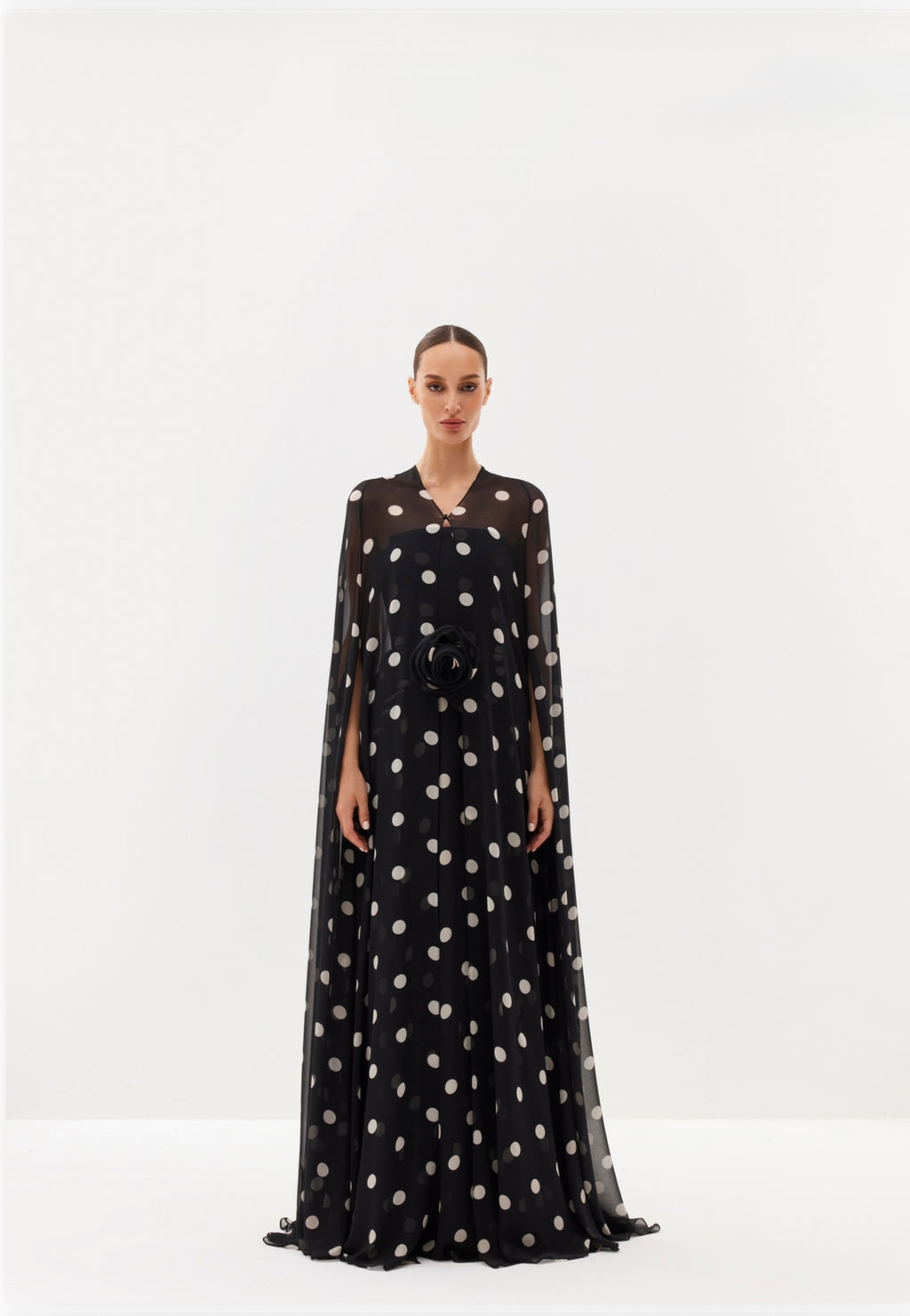 White polka-dot maxi dress with sheer cape
