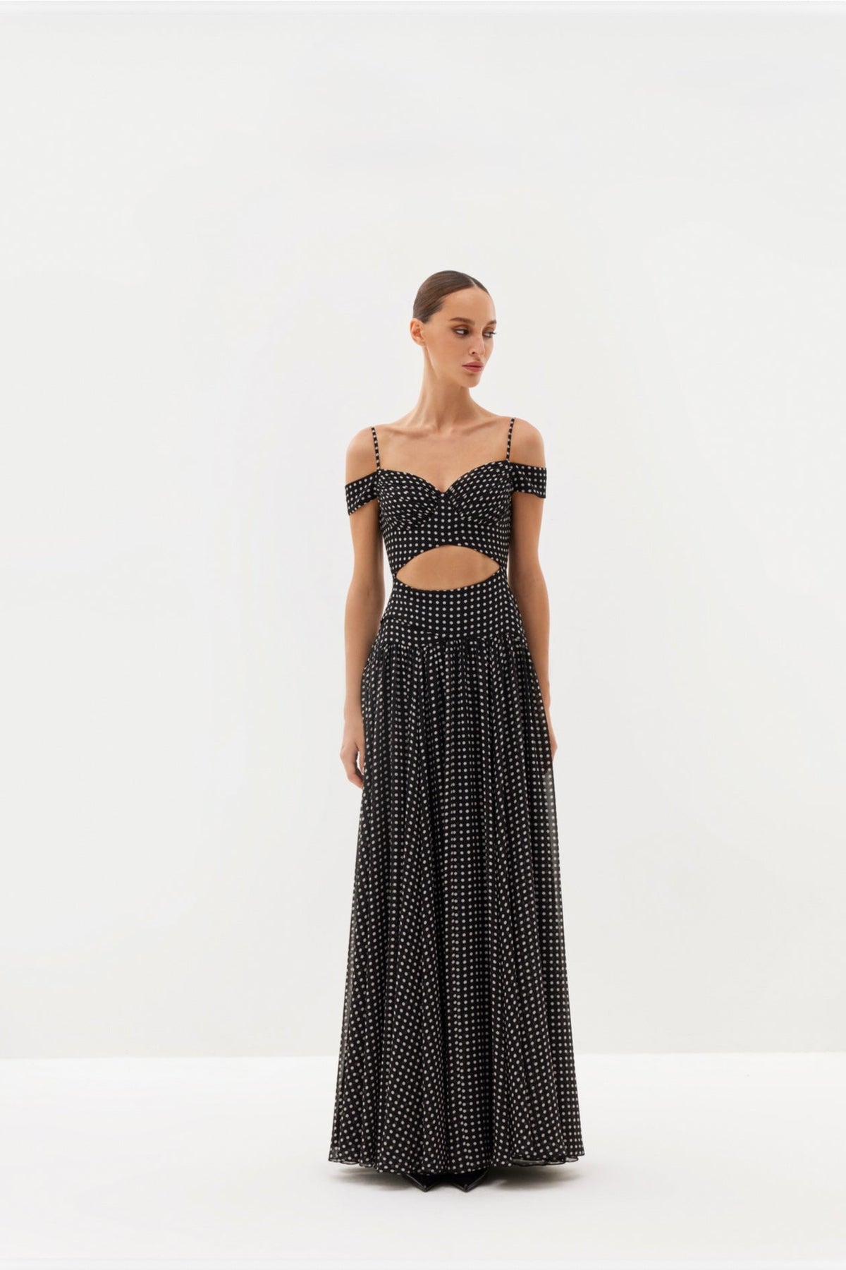 Black polka-dot maxi dress with cut-out detail