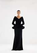 Black velvet sculptural off-shoulder gown