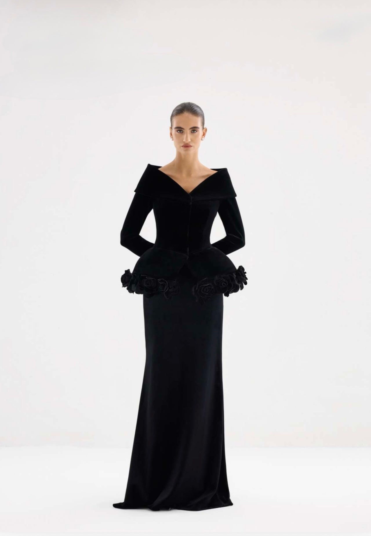 Black velvet sculptural off-shoulder gown