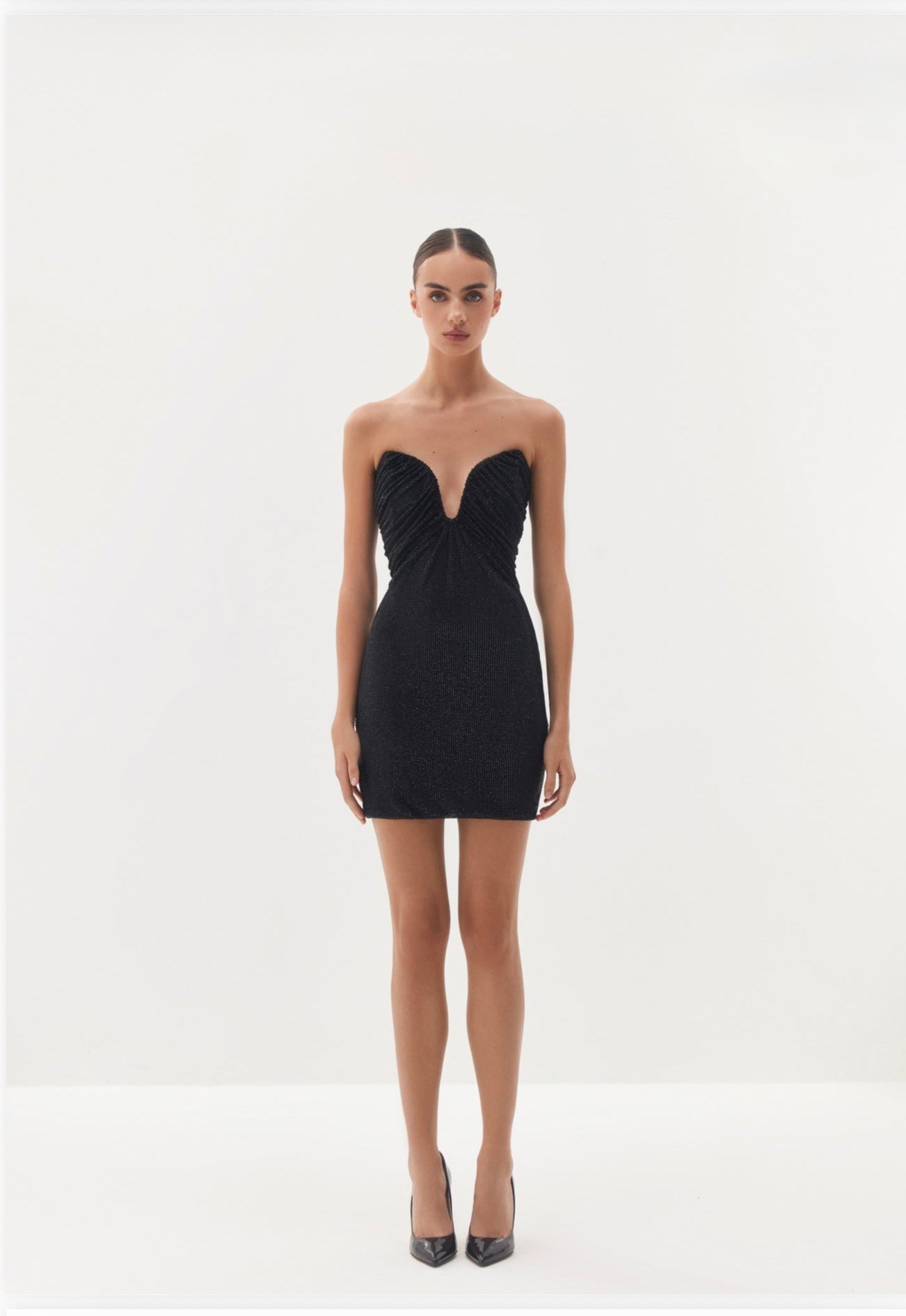 Black strapless mini dress with draped neckline