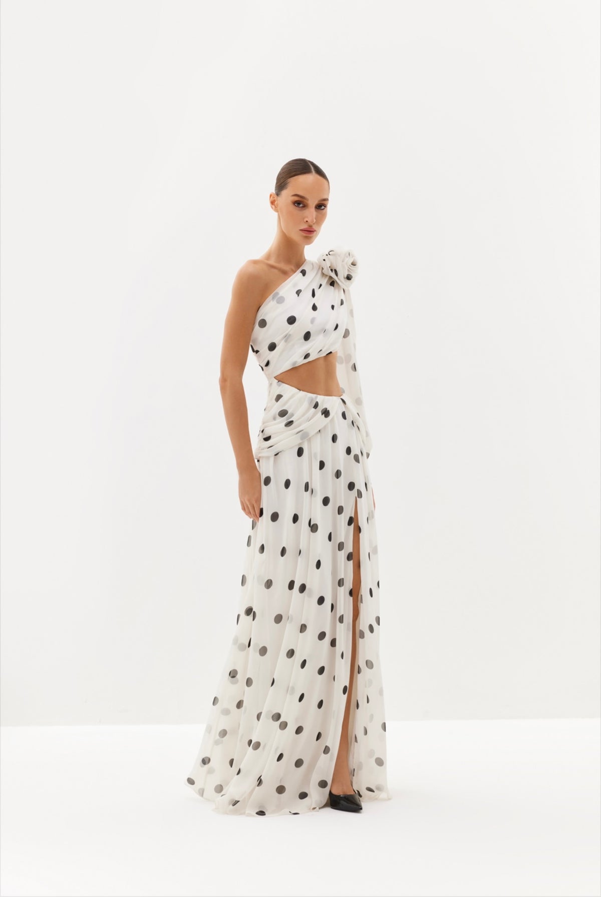Black polka-dot one-shoulder maxi dress with sheer drape