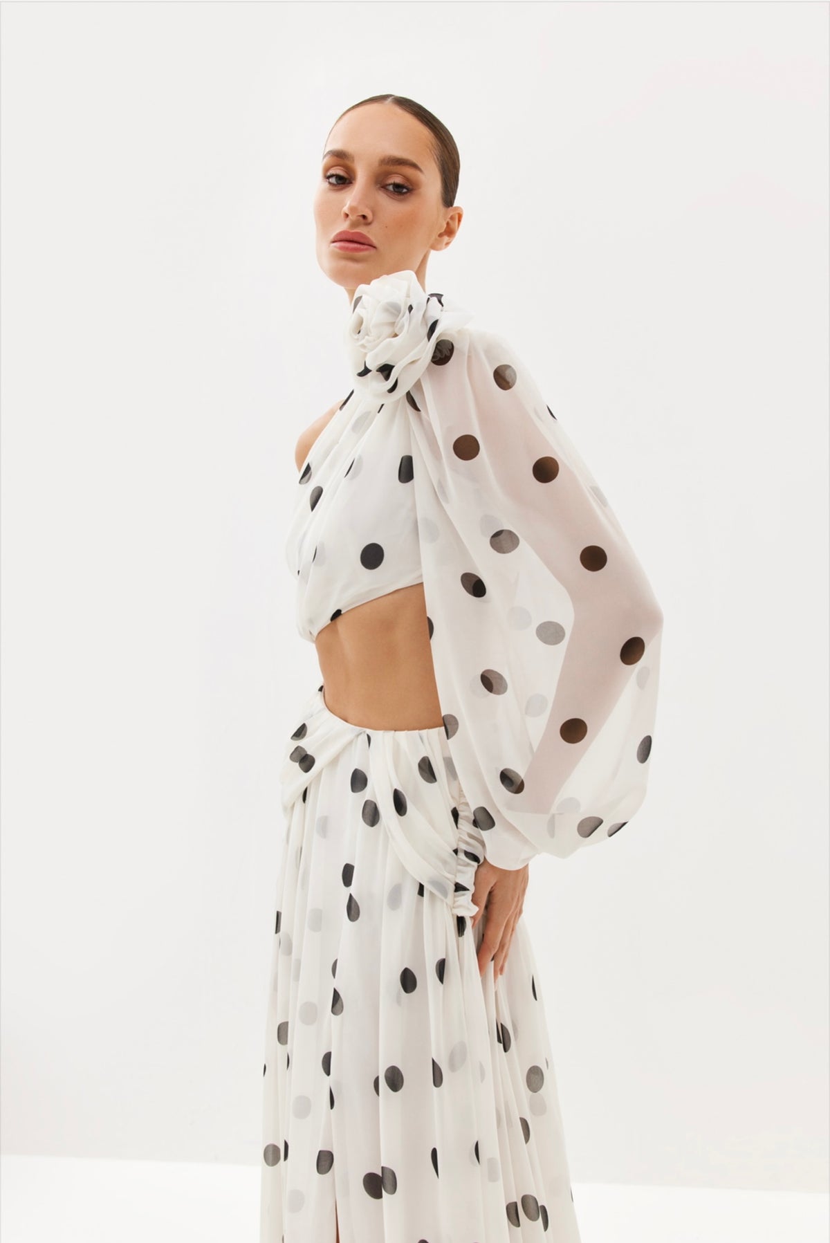 Black polka-dot one-shoulder maxi dress with sheer drape