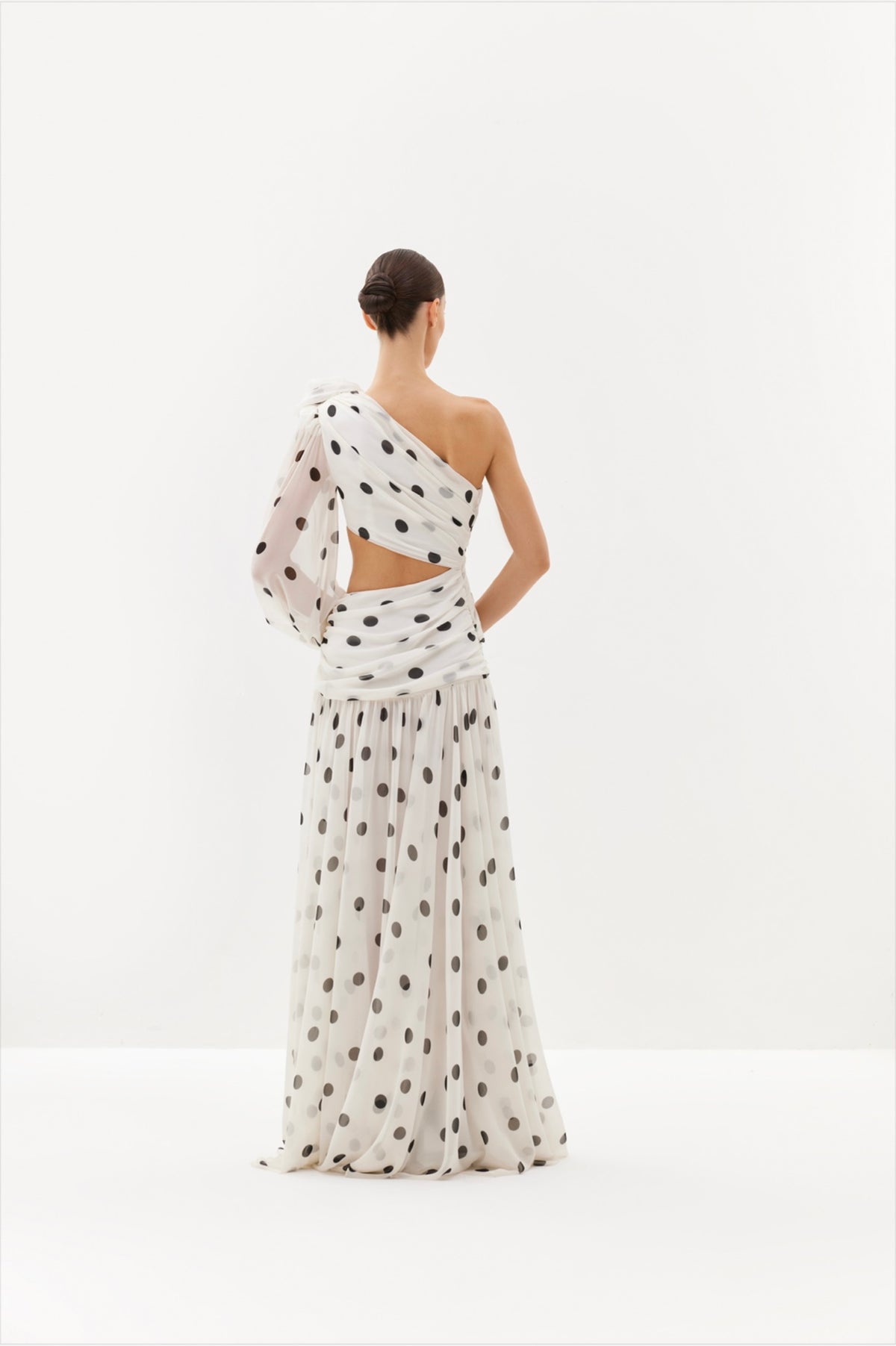 Black polka-dot one-shoulder maxi dress with sheer drape